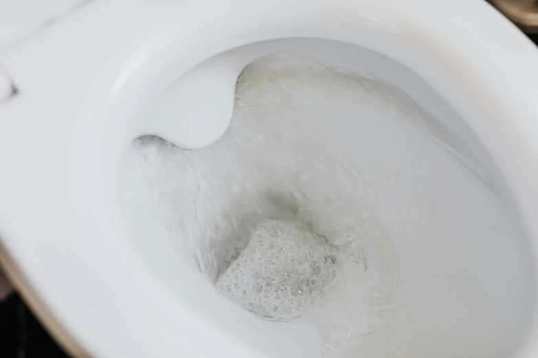 a close up of a toilet with the seat up, by Julia Pishtar, dissolving, filling the frame, goop, white foam