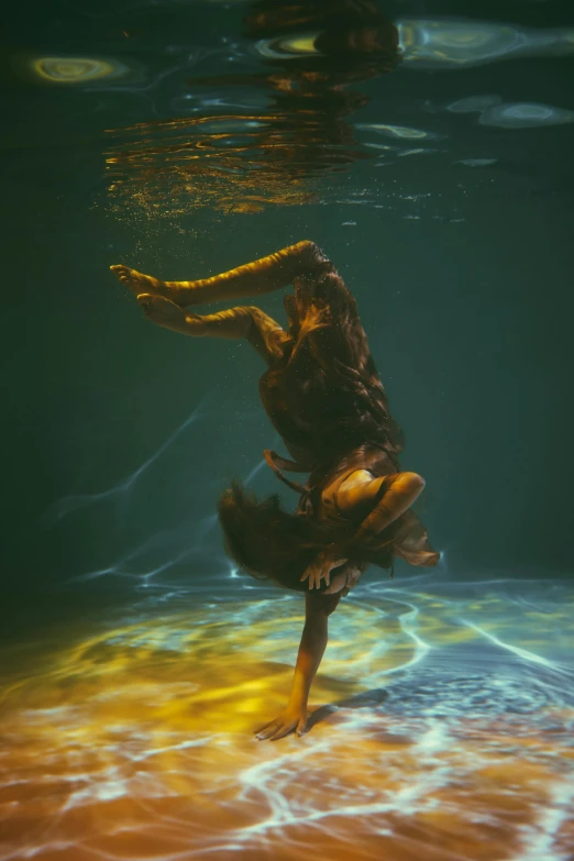 a man that is standing in the water, an album cover, inspired by Brooke Shaden, unsplash contest winner, female dancer, intricate ”, deity)