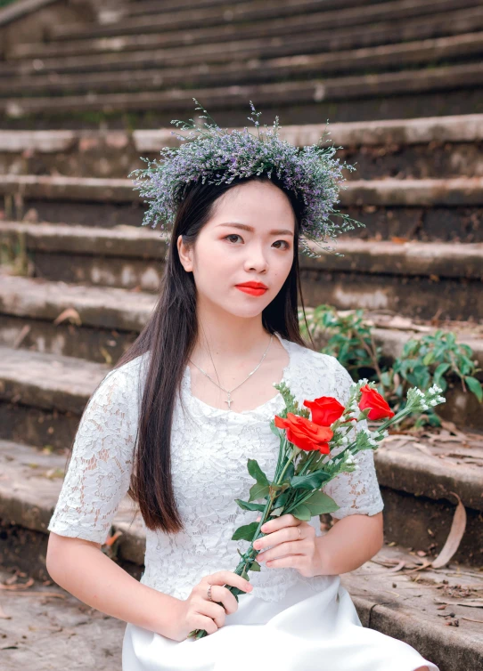 a woman in a white dress holding a red rose, inspired by Ruth Jên, pexels contest winner, vietnamese woman, wearing a light grey crown, instagram picture, outdoor photo