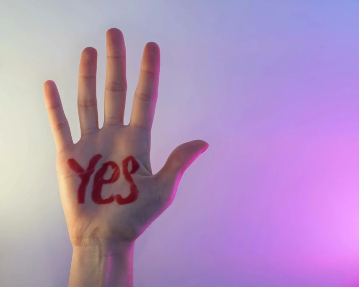 a hand with the word yes painted on it, pexels, bisexual lighting, screensaver, palm body, confidence