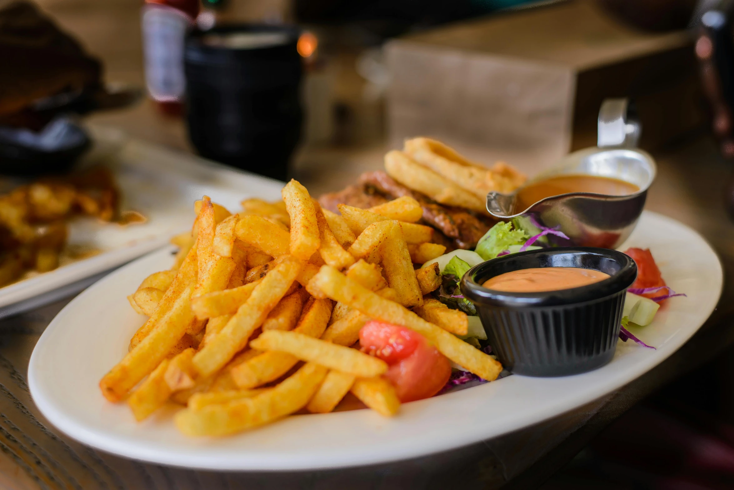 a close up of a plate of food on a table, inspired by Pia Fries, pexels contest winner, realism, red stripe, 🦩🪐🐞👩🏻🦳, chips, brown sauce