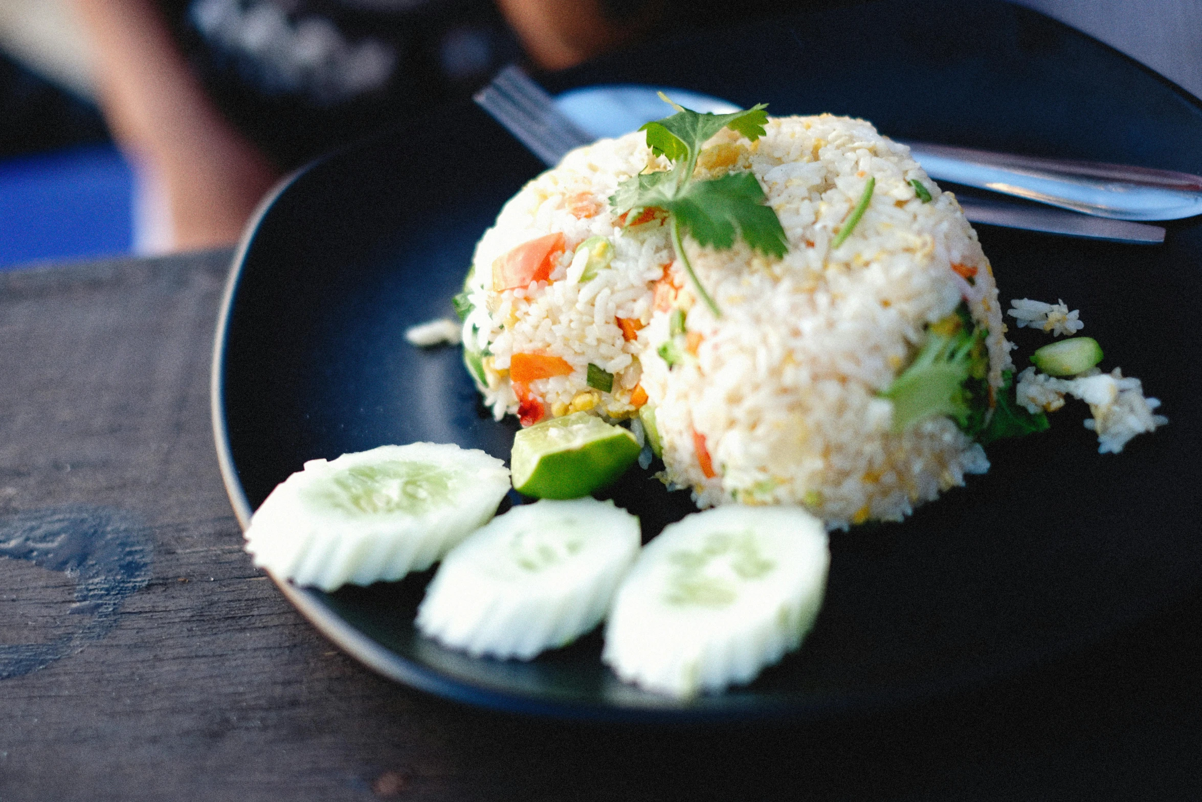 a black plate topped with rice and cucumbers, unsplash, square, bangkok, multicoloured, delightful surroundings