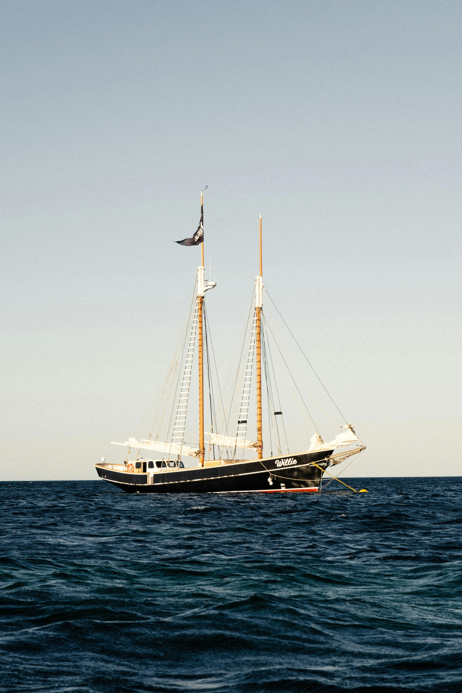 a sail boat in the middle of the ocean, slide show, in australia, restored, exterior shot