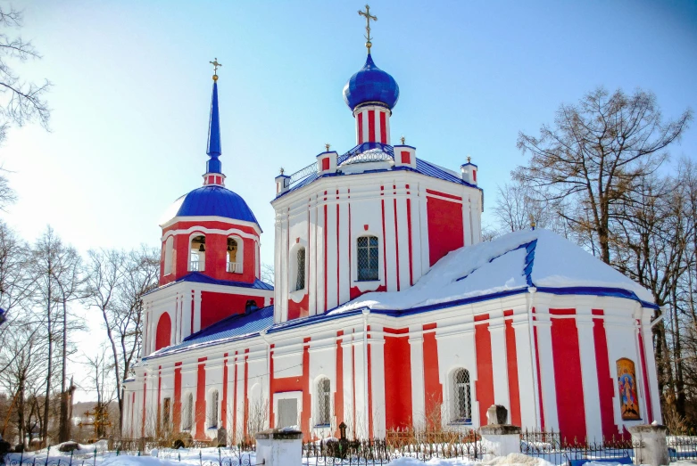 a red and white church in the snow, inspired by Illarion Pryanishnikov, pexels contest winner, red and blue color theme, square, 000 — википедия, white and orange