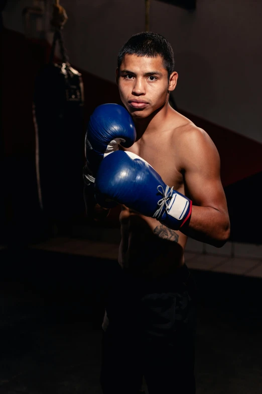 a close up of a person wearing boxing gloves, a portrait, inspired by Randy Vargas, pexels contest winner, full body in shot, age 2 0, instagram post, joseph moncada