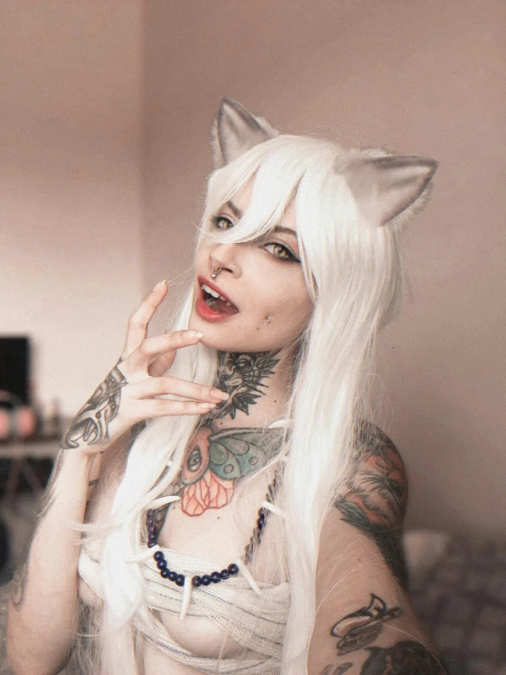 a woman with white hair wearing a cat costume, inspired by Elsa Bleda, reddit, furry art, y 2 k cutecore clowncore, tattoos and piercings, photograph taken in 2 0 2 0, female fox