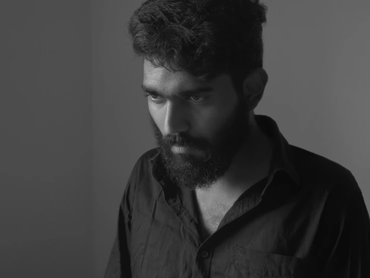 a black and white photo of a man with a beard, by Max Dauthendey, pexels contest winner, serial art, ayan nag, production still, halfbody portrait, video still