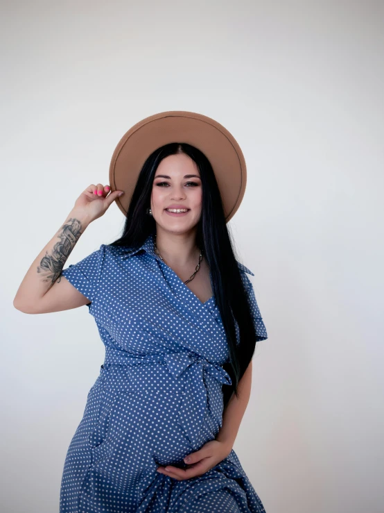 a woman in a dress and hat posing for a picture, blue shirt, facebook profile picture, promo image, joel torres