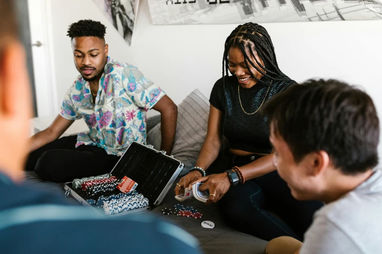 a group of people sitting on top of a couch, pexels contest winner, black arts movement, playing poker, avatar image, profile image