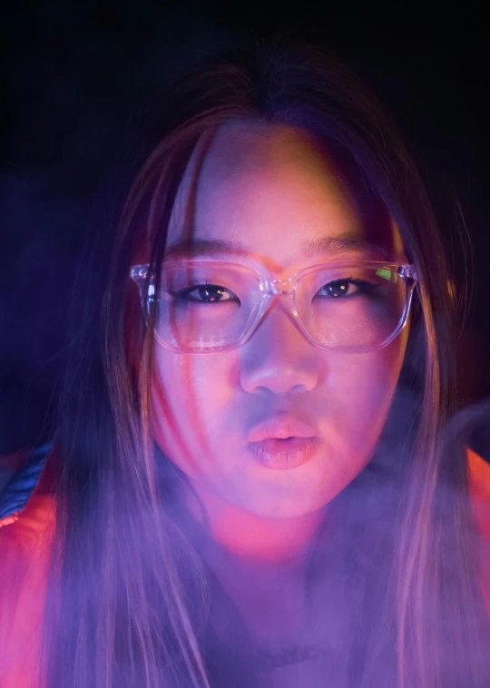 a close up of a person wearing glasses, inspired by Liam Wong, smoke coming out of her mouth, black light, discord profile picture, commercial photo