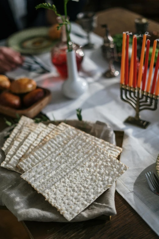 a table topped with lots of different types of food, hebrew, candles, 1 6 x 1 6, detail shot