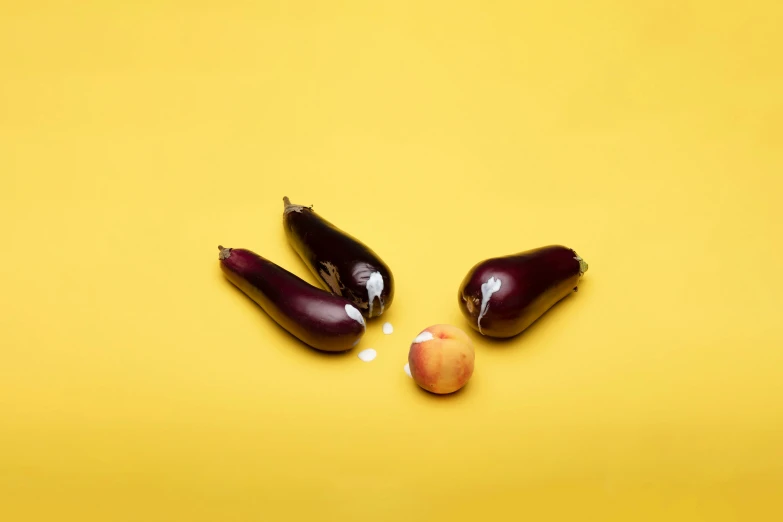 two eggplants and an apple on a yellow background, by Doug Ohlson, trending on pexels, spilling ketchup, ignant, seen from below, asset on grey background