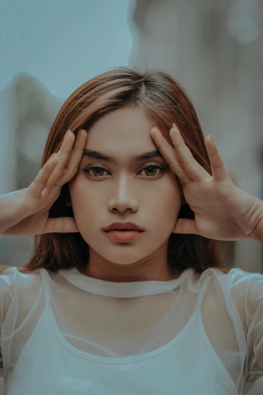 a woman covering her face with her hands, trending on pexels, surrealism, korean symmetrical face, portrait of modern darna, straight hairstyle, square facial structure