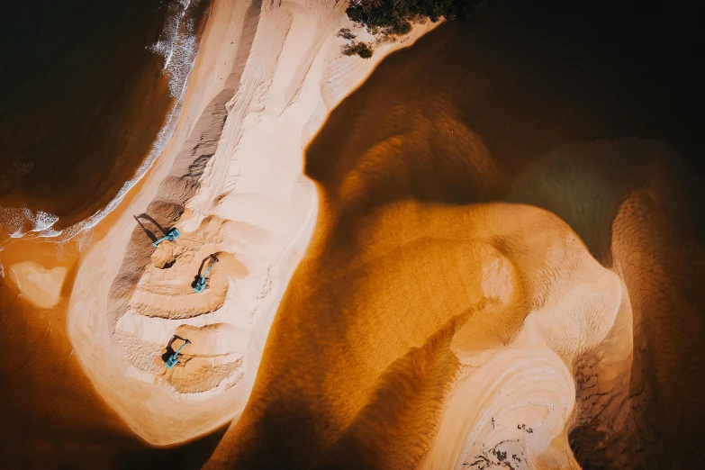 a bird's eye view of a sandy beach, by Daniel Lieske, pexels contest winner, deep earthy colours, thumbnail, australian outback, cinematic shot!