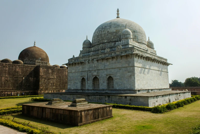 a large white building sitting on top of a lush green field, a marble sculpture, samikshavad, geodesic domes, thumbnail, madhubani, high-quality photo