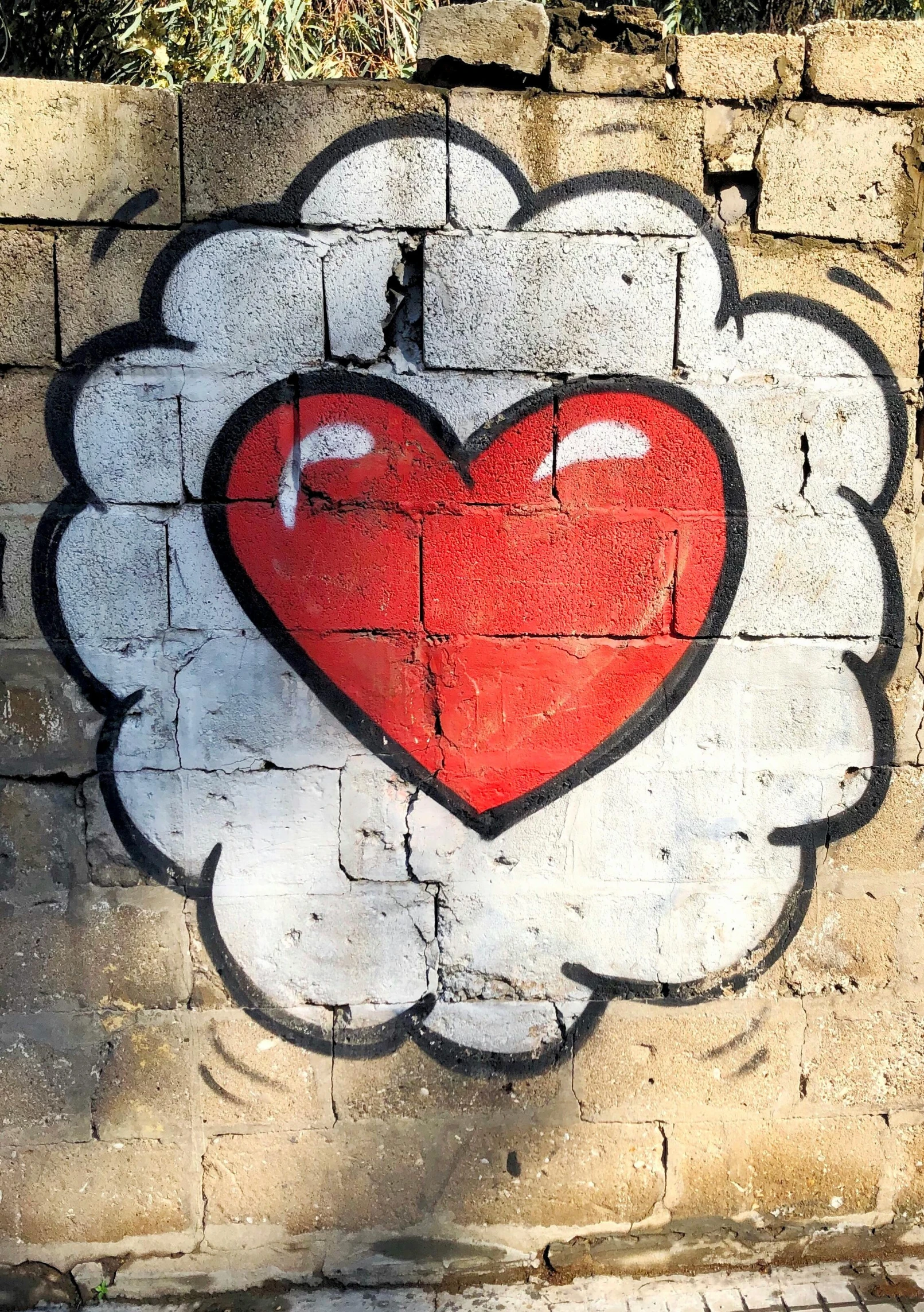 a brick wall with a heart painted on it, a cartoon, inspired by Banksy, trending on unsplash, graffiti, fat cloud, profile image, brains, mdma