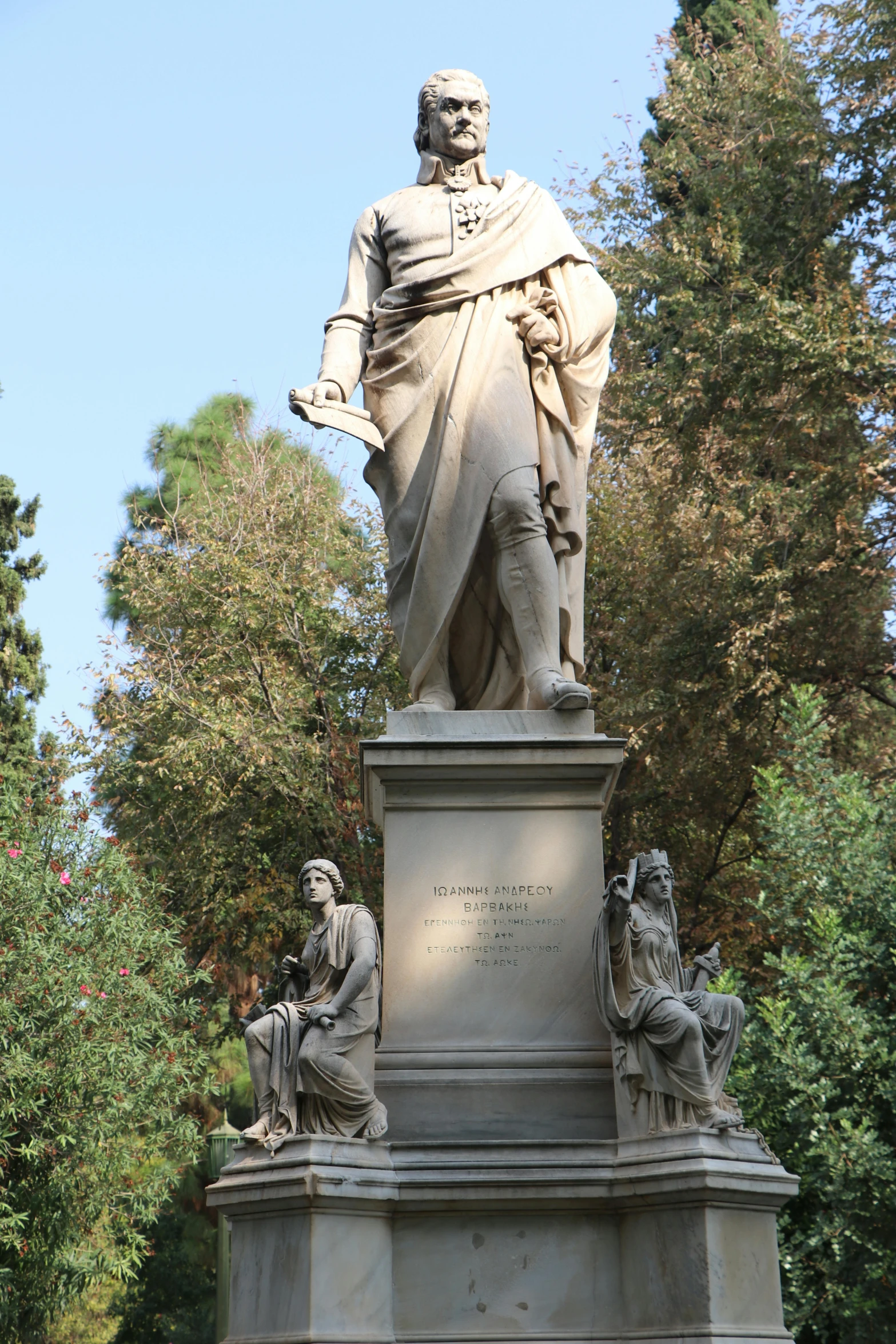 a statue of a man sitting on top of a pedestal, a statue, inspired by Giovanni Battista Innocenzo Colombo, florence nightingale, lush surroundings, walking to the right, filippo brunelleschi