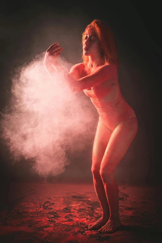 a naked woman standing in front of a red light, an airbrush painting, unsplash contest winner, smoke and thick dust in the air, pink volumetric studio lighting, sand particles, made of cotton candy