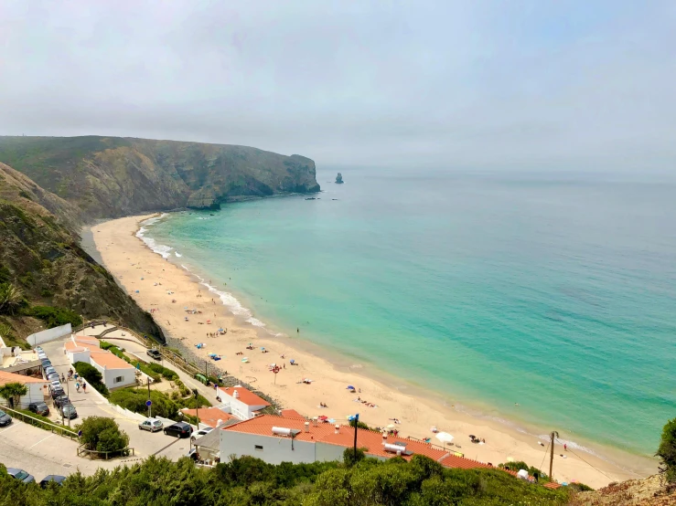 a view of a beach from the top of a hill, by Olivia Peguero, pexels contest winner, portugal, margot robbie on the beach, square, pch