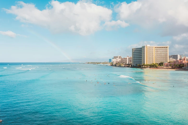 a large body of water next to a beach, by Ryan Pancoast, pexels contest winner, waikiki beach, rinko kawauchi, jen atkin, kailee mandel