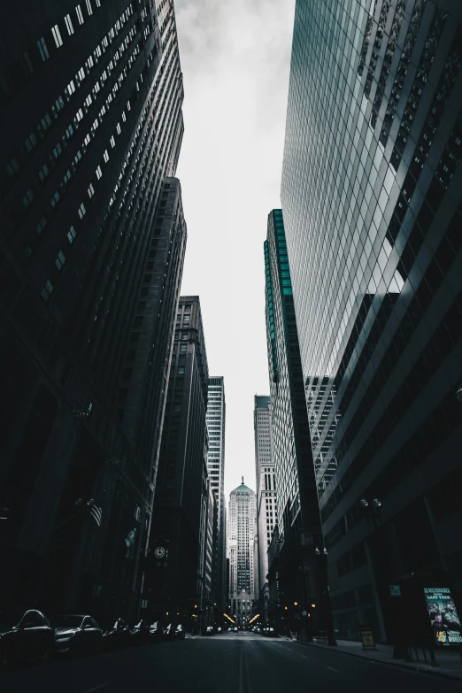 a black and white photo of a city street, pexels contest winner, modernism, high rise skyscrapers, location [ chicago ( alley ) ], tall obsidian architecture, buildings made out of glass