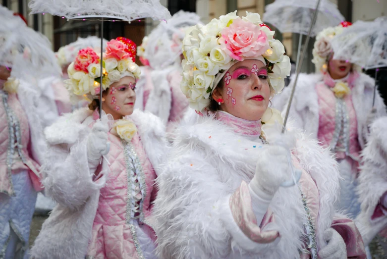 a group of women dressed in white holding umbrellas, a photo, inspired by Limbourg brothers, rococo, wearing a pink head band, wearing intricate fur armor, unsplash contest winning photo, parade