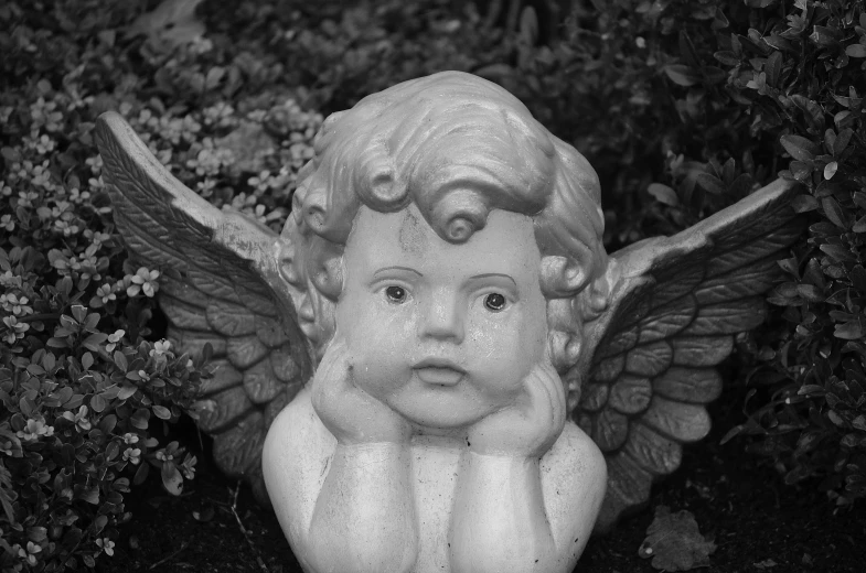 a black and white photo of a statue of an angel, pixabay contest winner, mark ryden in the style of, bashful expression, 1940s photo, round faced