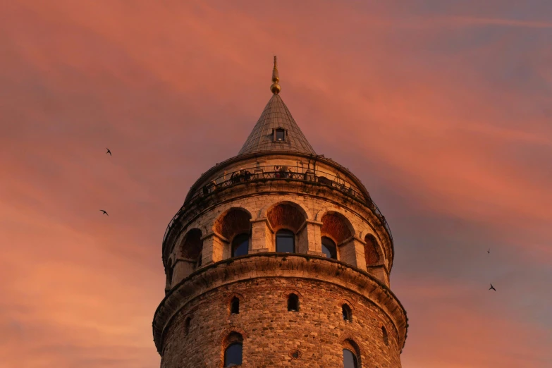 a tall tower with a clock on top of it, inspired by Kerembeyit, pexels contest winner, hurufiyya, at dusk at golden hour, curled perspective, ottoman sultan, gray