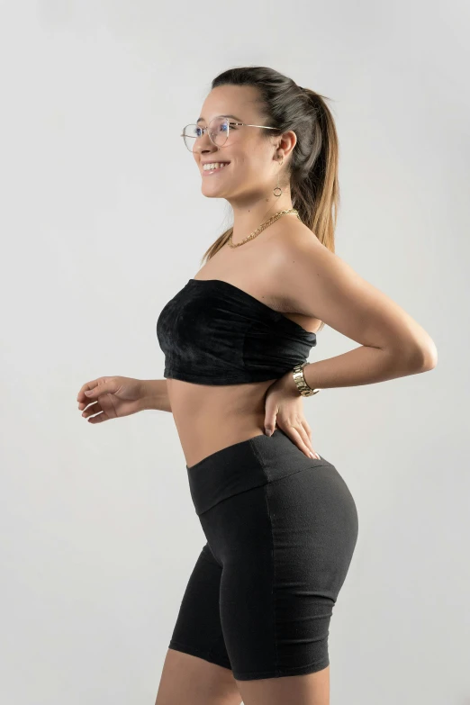 a woman in a black top and black shorts, highly upvoted, black leggings, tube-top dress, profile image