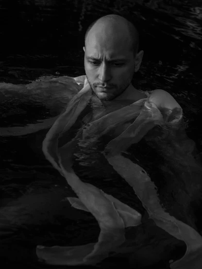 a man floating in a body of water, a portrait, inspired by Dmitry Levitzky, ethereal eel, bw, award winning digital art, charon