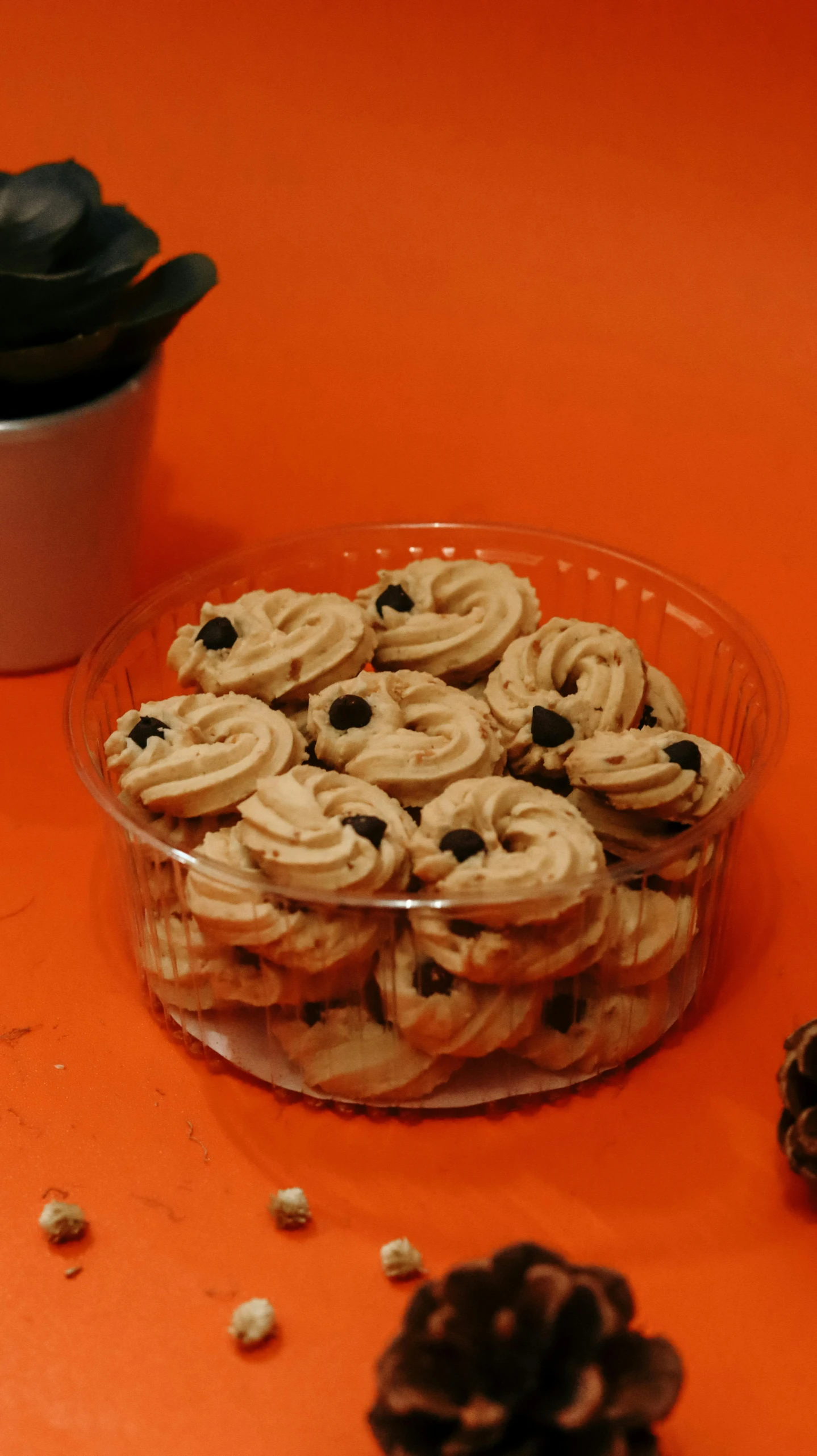 a plate of cookies next to a cup of coffee, hurufiyya, low quality photo, blueberry, spiralling, thumbnail