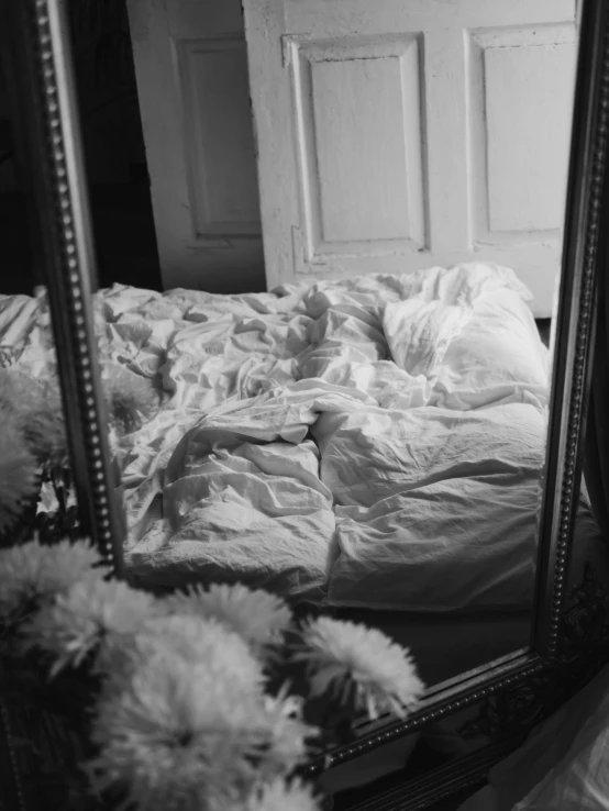 a black and white photo of a bed and a mirror, inspired by Vivian Maier, baroque, 1996), expired film analog photography, flowers around, joel fletcher