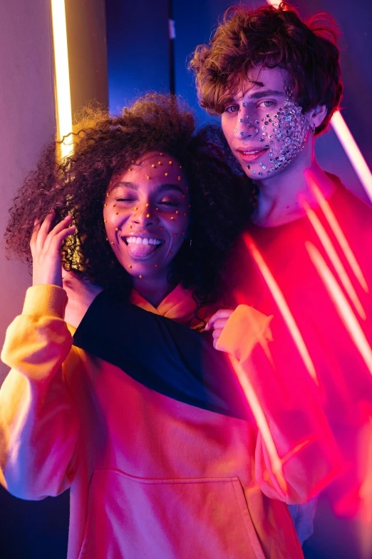 a man and a woman standing next to each other, by Cosmo Alexander, trending on pexels, light and space, goblins partying at a rave, portrait happy colors, she has a glow coming from her, light skin