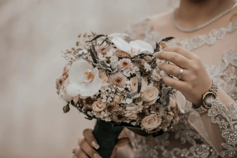 a woman in a wedding dress holding a bouquet of flowers, trending on unsplash, silver and muted colors, detailed and intricate image, muted browns, celebrating