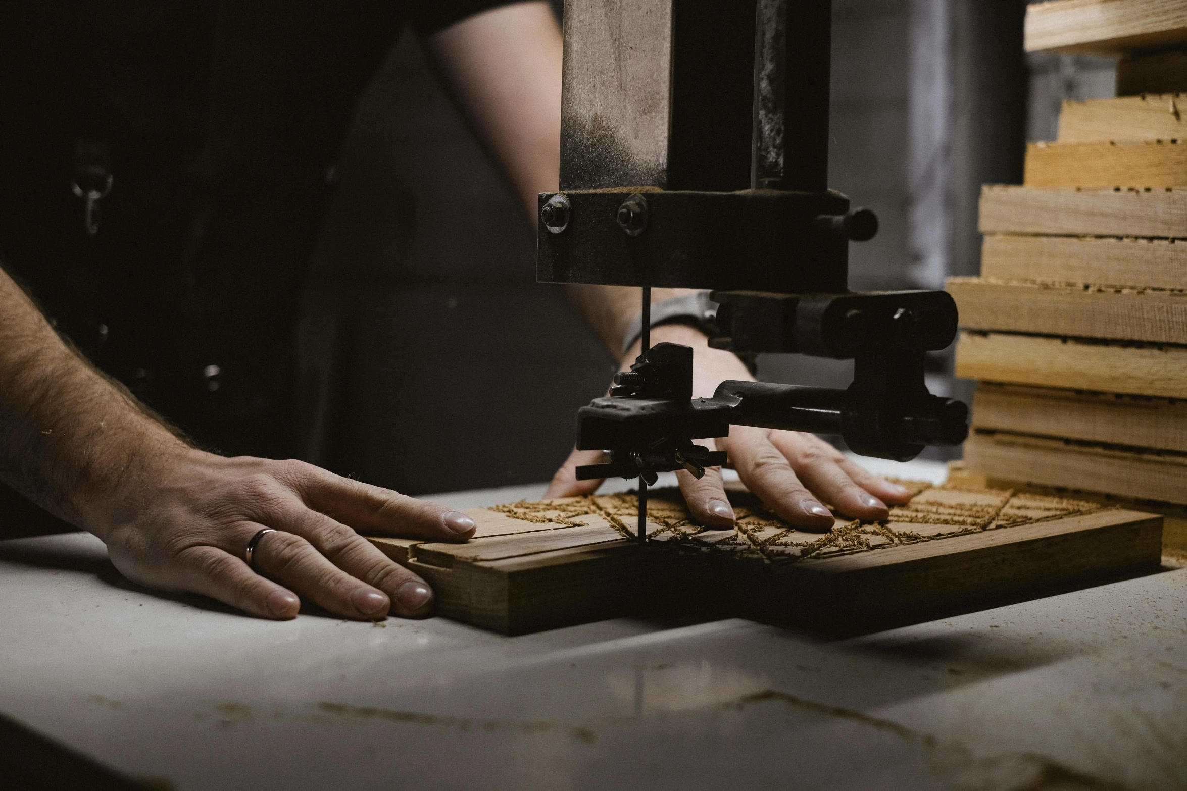 a man working on a piece of wood with a machine, pexels contest winner, private press, food. craft and adventure, gunsmithing, profile image, plating