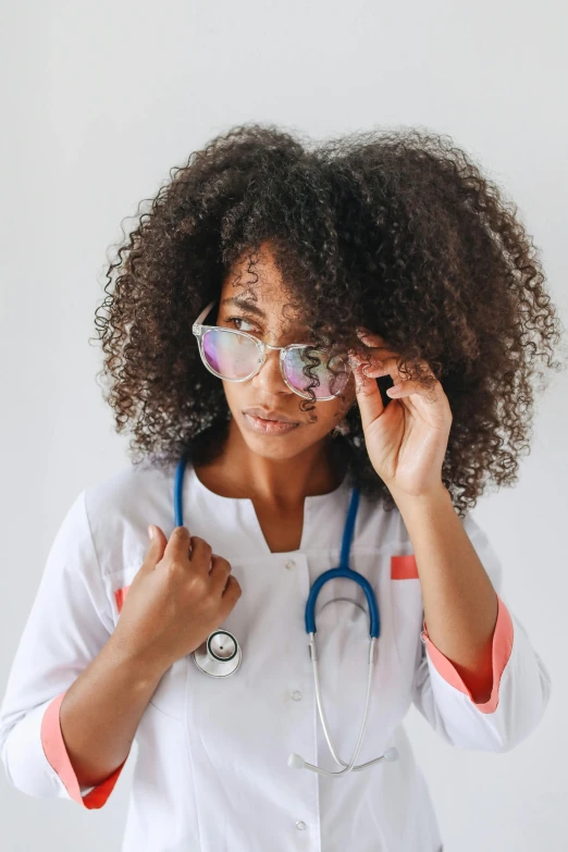 a woman with glasses and a stethoscope, inspired by Dr. Atl, trending on pexels, afrofuturism, wavy hair spread out, tech robes, lgbtq, small square glasses