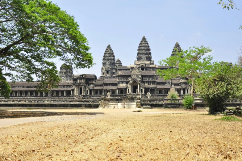 a large stone building surrounded by trees, hurufiyya, angkor wat, fan favorite, 8k resolution”