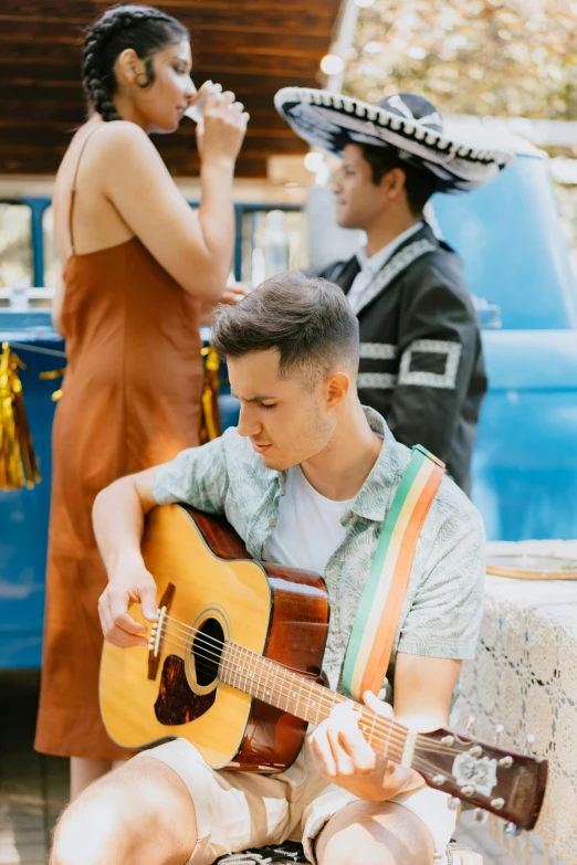 a man sitting on a bench playing a guitar, jordan grimmer and natasha tan, in style of lam manh, lgbtq, kombi