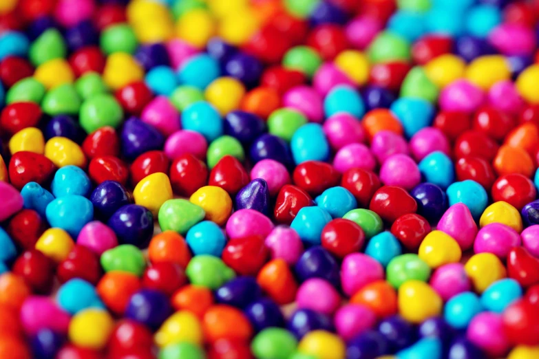 a pile of colorful candy sitting on top of a table, by Joe Bowler, color field, 2 5 6 x 2 5 6 pixels, beans, cute colorful adorable, grain”