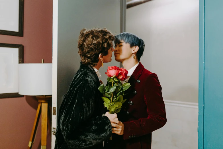 a couple of people that are kissing each other, an album cover, by Julia Pishtar, pexels contest winner, holding a rose, hong june hyung, gay, indoor scene