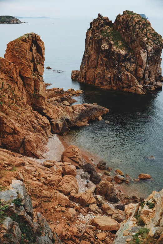 a large body of water next to a rocky shore, pexels contest winner, romanticism, medium format. soft light, brown, archipelago, byzantine