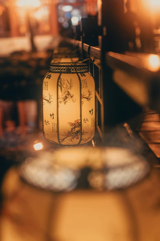 a close up of a lamp on a table, by Adam Szentpétery, trending on unsplash, arts and crafts movement, tokyo izakaya scene, tea drinking and paper lanterns, intricate fine details, soft vintage glow