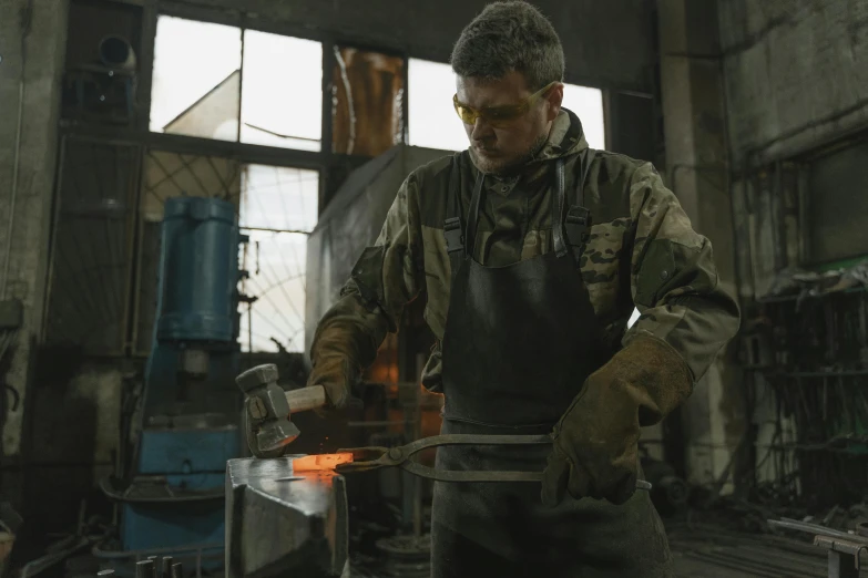 a man is working on a piece of metal, by Adam Marczyński, pexels contest winner, renaissance, cast iron material, australian, 15081959 21121991 01012000 4k, thumbnail