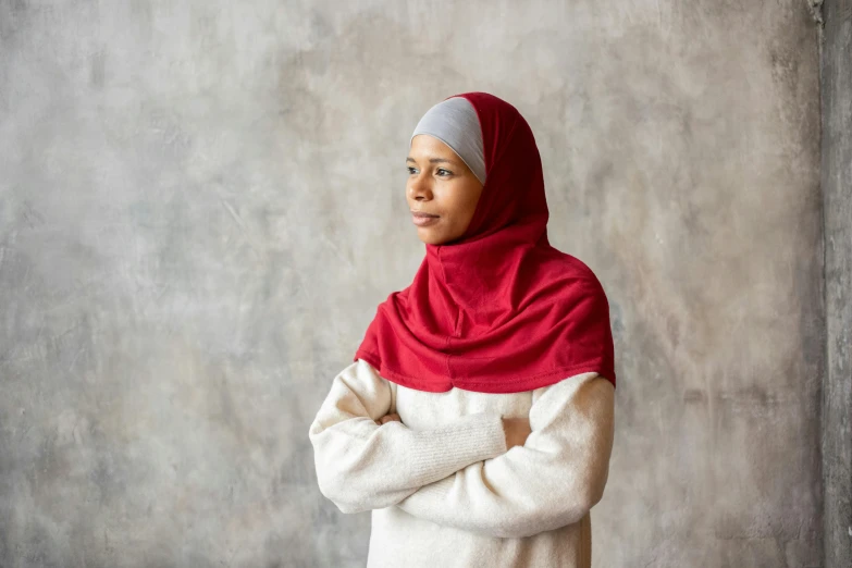 a woman wearing a red and white scarf, hurufiyya, soft grey and red natural light, dressed in red velvet, sheikh, lined in cotton