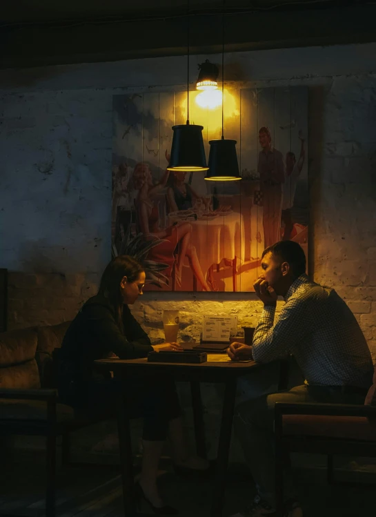 two people sitting at a table in a dimly lit room, pexels contest winner, realism, medium format. soft light, promo image, maxim sukharev, cozy cafe background