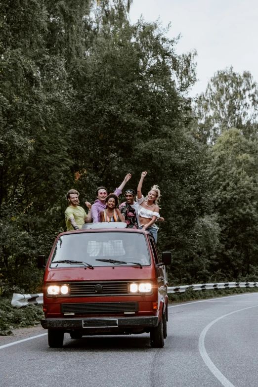 a group of people riding in the back of a van, pexels contest winner, renaissance, evening!! in the forest, retro and 1 9 8 0 s style, waving and smiling, trip to legnica