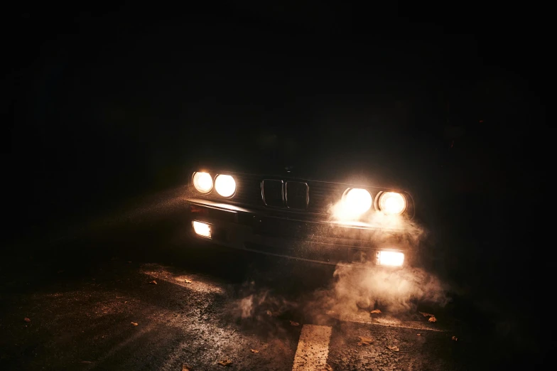 a car driving on a wet road at night, an album cover, inspired by Elsa Bleda, smoke out of eyes, bmw e 3 0, profile image, brown mist