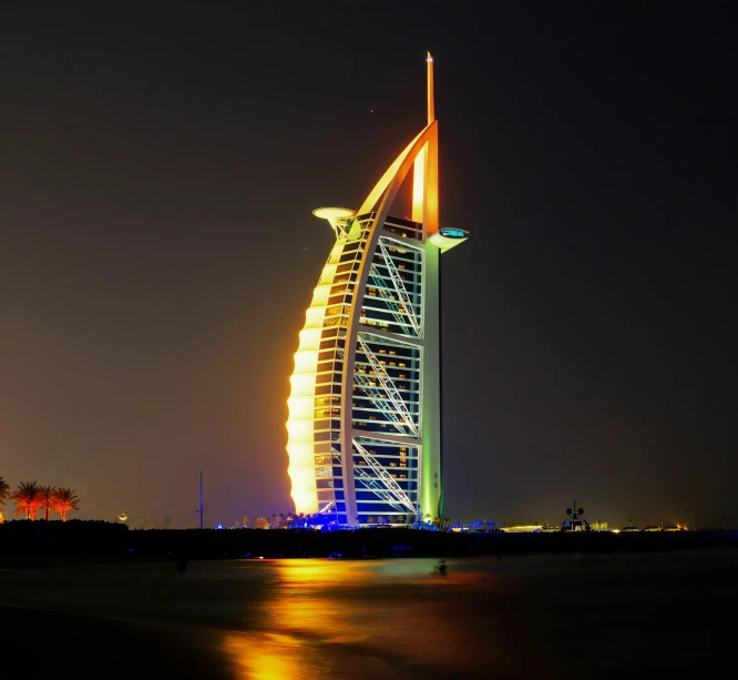 the burj al arab hotel lit up at night, an album cover, pexels contest winner, hurufiyya, thumbnail, performing, ready to eat, spire