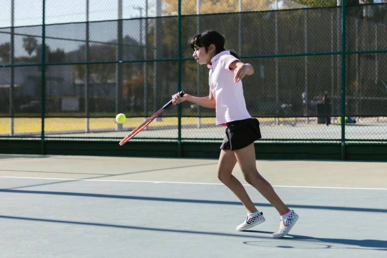 a woman hitting a tennis ball with a racquet, unsplash, shin hanga, square, high school, nivanh chanthara, fall season