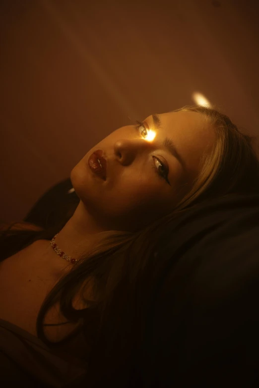 a beautiful young woman laying on top of a bed, an album cover, inspired by Elsa Bleda, unsplash, photorealism, police lights shine on her face, sydney sweeney, still from a music video, red light